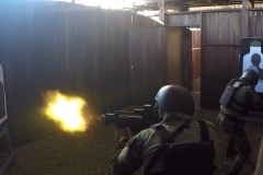 An Uraguayan competitor fires his weapon during a simulated hostage rescue mission July 22, 2017, during Fuerzas Comando in Cerrito, Paraguay. Teams must work together to take out all the enemy targets and rescue a hostage from captivity. Fuerzas Comando aims to improve partnerships among competing countries. (U.S. Army photo illustration by Pfc. Lauren Sam/Released) (This image was created by capturing a still frame from a video.)